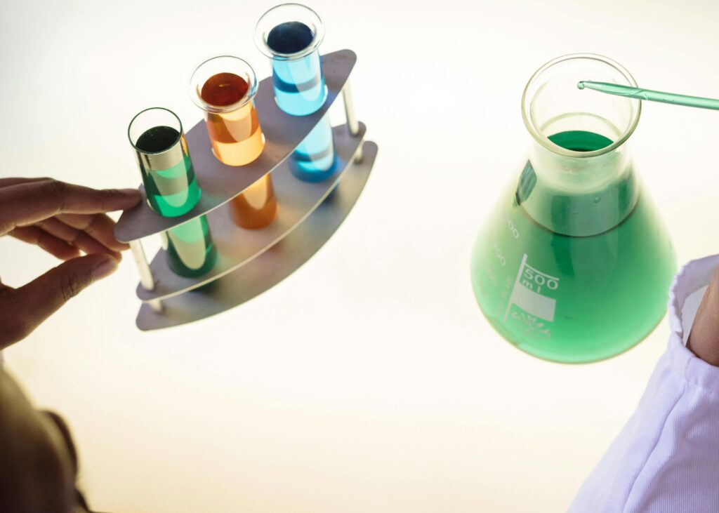 A vibrant science experiment involving colorful liquids in test tubes and a flask.